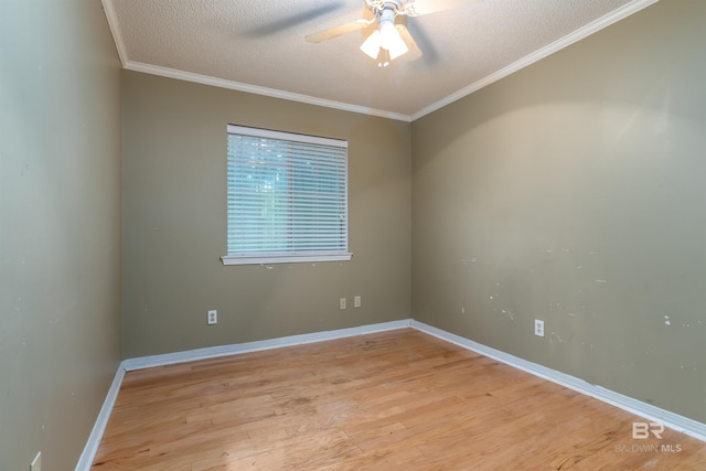 spare room with a textured ceiling, ceiling fan, ornamental molding, and light wood-style floors