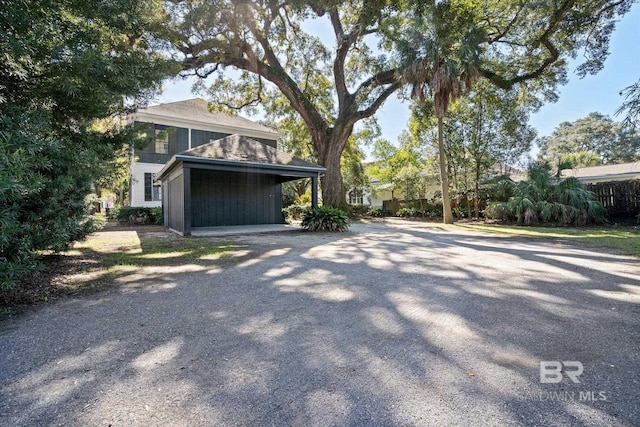 view of home's exterior featuring a carport