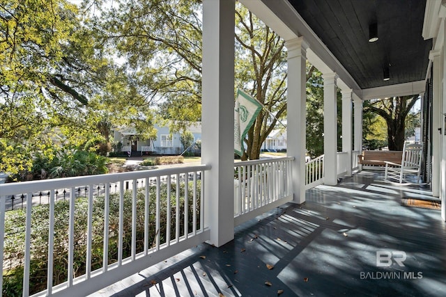 wooden deck featuring covered porch