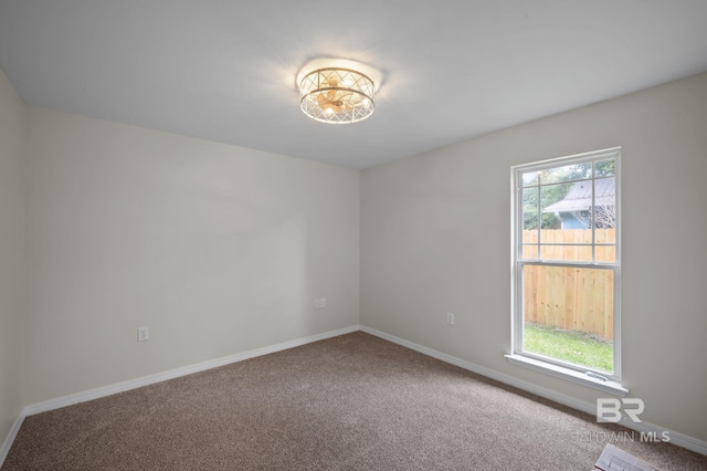 602 W 4th St, Bay Minette, AL 36507 - empty room featuring carpet and baseboards