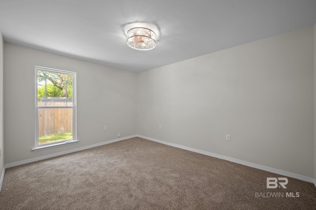 602 W 4th St, Bay Minette, AL 36507 - spare room featuring carpet flooring and baseboards