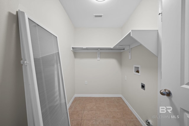 602 W 4th St, Bay Minette, AL 36507 - laundry room featuring hookup for a washing machine, tile patterned flooring, hookup for an electric dryer, and baseboards