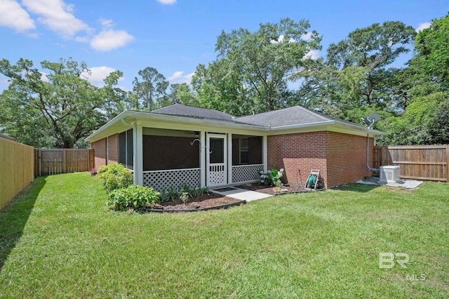 602 W 4th St, Bay Minette, AL 36507 - rear view of house with brick siding and a sunroom