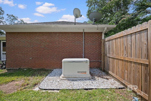 602 W 4th St, Bay Minette, AL 36507 - exterior view of a power unit, brick siding, a downspout, gutters, and a satellite dish