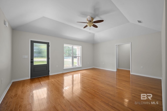 602 W 4th St, Bay Minette, AL 36507 - unfurnished living room with vaulted ceiling, a ceiling fan, wood finished floors, and baseboards