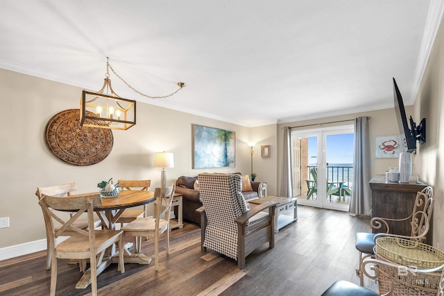969 W Beach Blvd Unit 1306, Gulf Shores, AL 36542 - living area featuring dark wood-style floors, ornamental molding, a chandelier, and baseboards