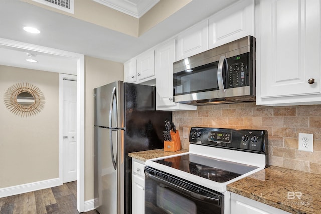 969 W Beach Blvd Unit 1306, Gulf Shores, AL 36542 - kitchen with appliances with stainless steel finishes, ornamental molding, baseboards, dark wood-style flooring, and white cabinets