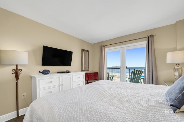 969 W Beach Blvd Unit 1306, Gulf Shores, AL 36542 - bedroom with access to outside, baseboards, and dark wood-type flooring