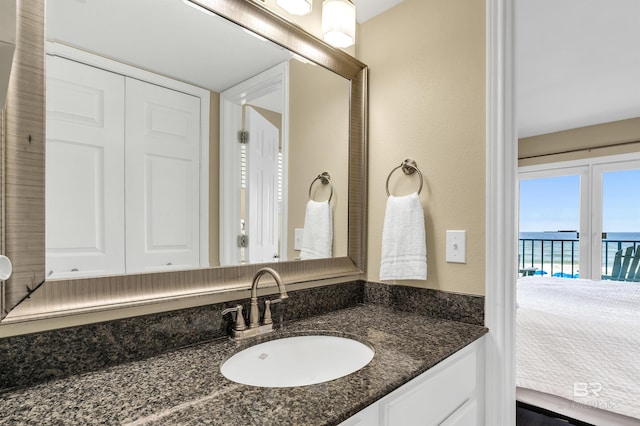 969 W Beach Blvd Unit 1306, Gulf Shores, AL 36542 - bathroom featuring vanity, ensuite bath, and a water view