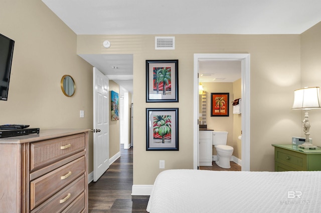 969 W Beach Blvd Unit 1306, Gulf Shores, AL 36542 - bedroom featuring baseboards, dark wood-type flooring, and ensuite bathroom