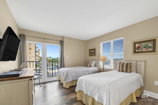 969 W Beach Blvd Unit 1306, Gulf Shores, AL 36542 - bedroom with wood finished floors, access to exterior, and baseboards