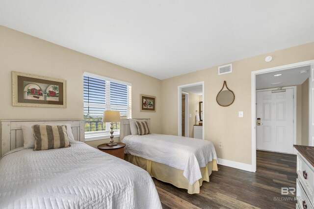 969 W Beach Blvd Unit 1306, Gulf Shores, AL 36542 - bedroom with dark wood-type flooring and baseboards