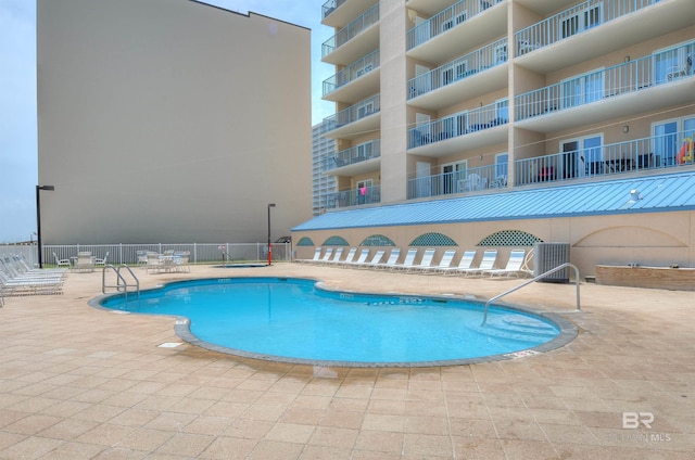 969 W Beach Blvd Unit 1306, Gulf Shores, AL 36542 - community pool featuring a patio area and central AC unit
