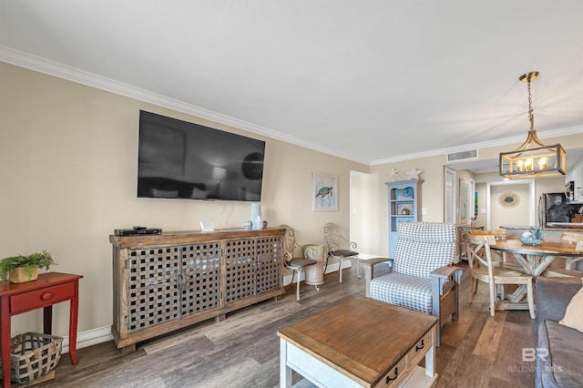 969 W Beach Blvd Unit 1306, Gulf Shores, AL 36542 - living area featuring crown molding, wood finished floors, a chandelier, and baseboards