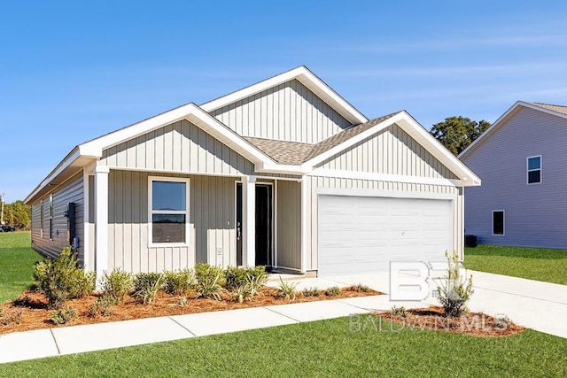 view of front of home featuring a garage and a front yard