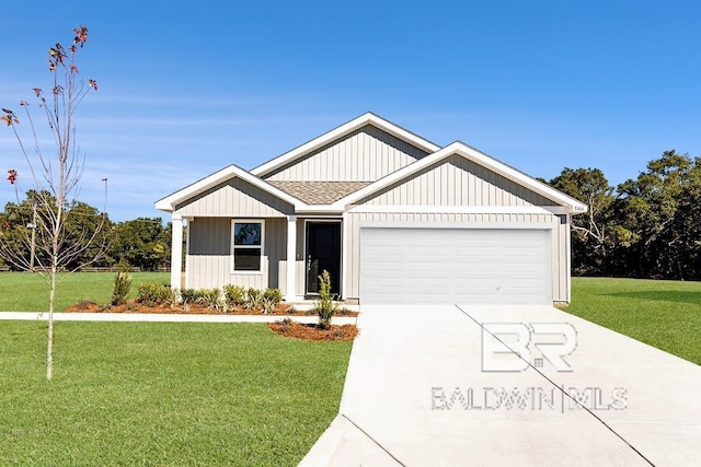 view of front of home featuring a garage and a front lawn