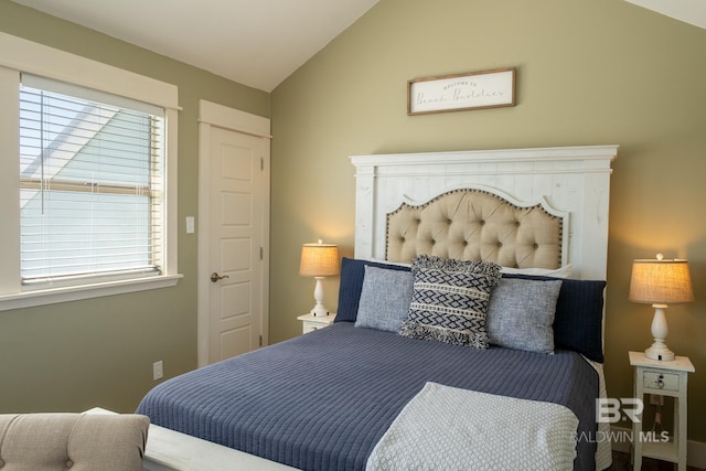 bedroom with lofted ceiling