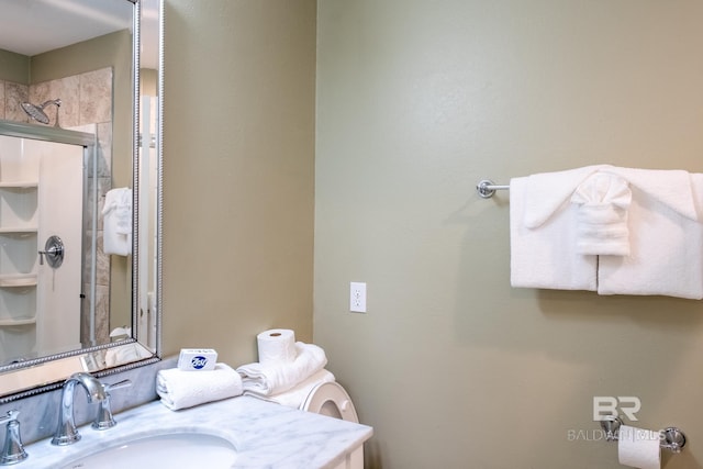 full bath featuring an enclosed shower and vanity