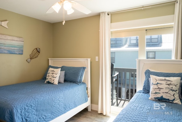 bedroom featuring wood finished floors and a ceiling fan