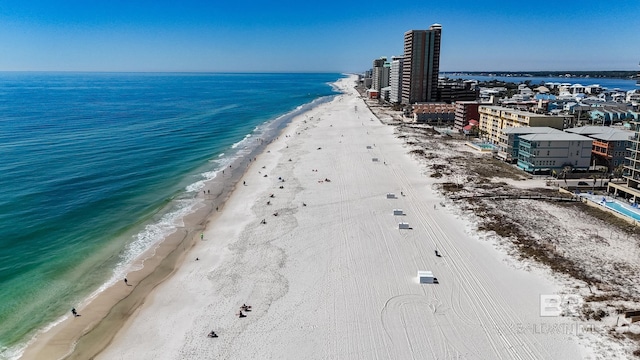 bird's eye view featuring a beach view and a water view