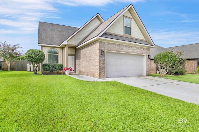 view of front of house featuring a garage and a front yard