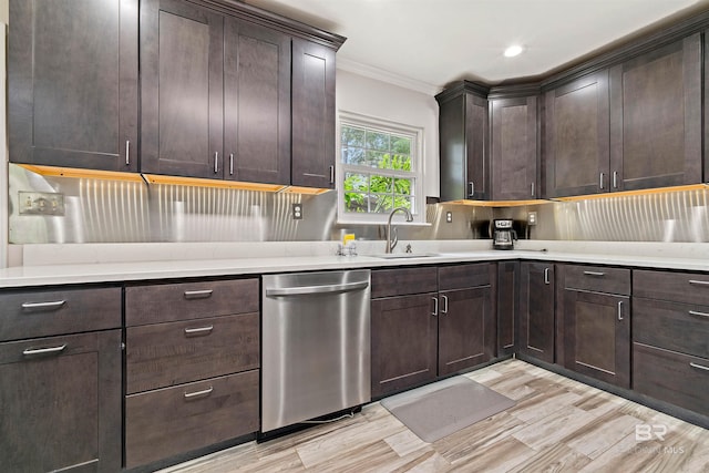 kitchen with dark brown cabinets, crown molding, sink, and stainless steel dishwasher