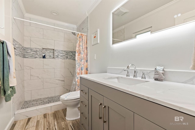 bathroom with ornamental molding, vanity, toilet, and a shower with shower curtain