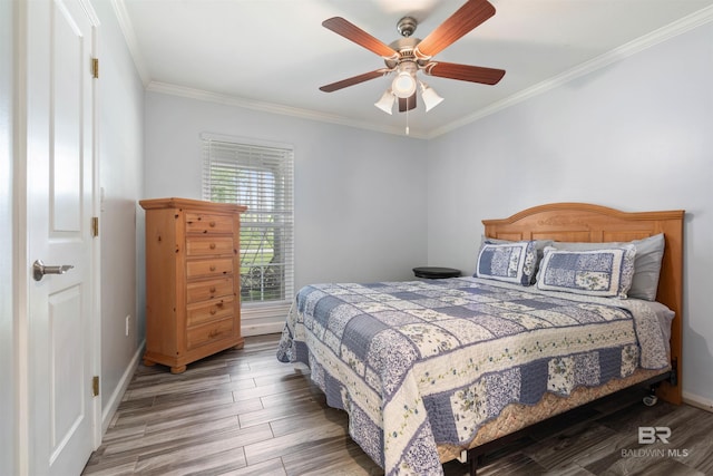 bedroom featuring wood-type flooring, ceiling fan, and crown molding