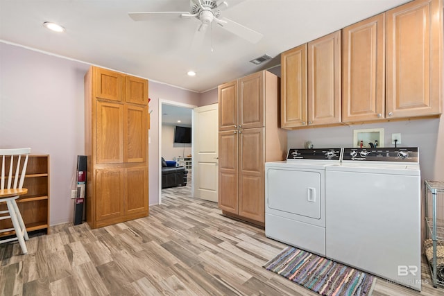 washroom with hookup for a washing machine, cabinets, ceiling fan, washer and clothes dryer, and light wood-type flooring