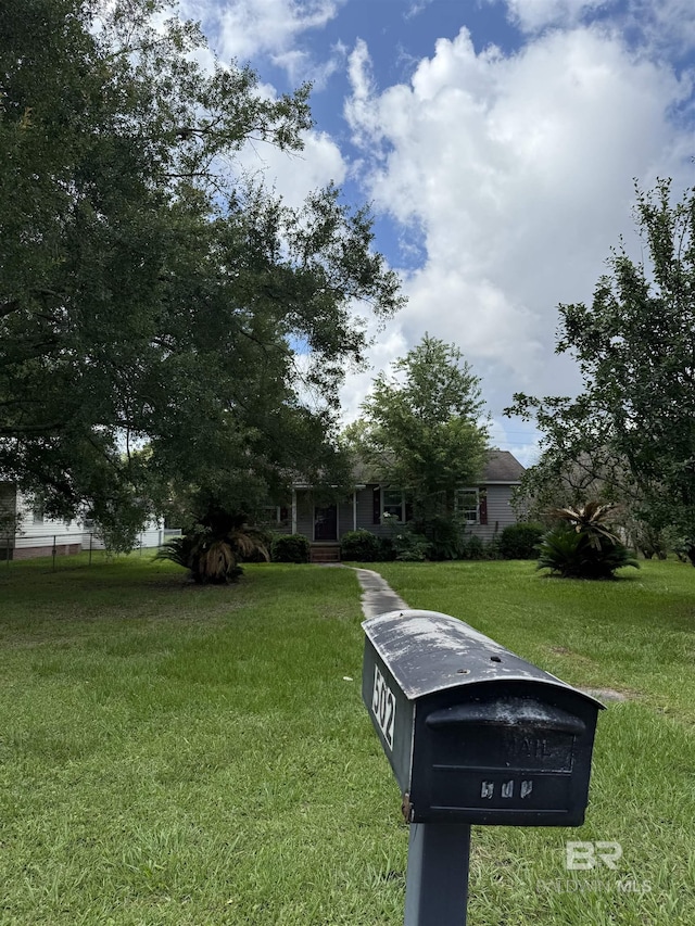 502 E Myrtle Ave, Foley, AL 36535 - view of property hidden behind natural elements with a front yard