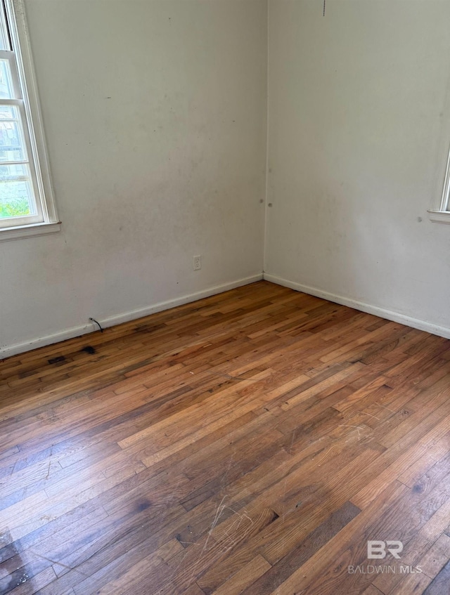 502 E Myrtle Ave, Foley, AL 36535 - empty room with wood-type flooring and baseboards