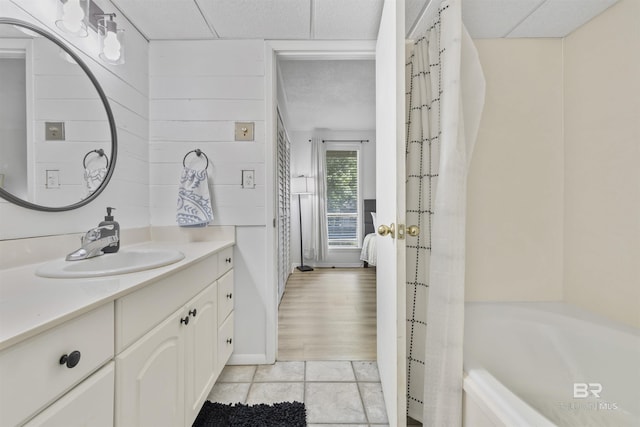 2086 N Seacliff Dr Unit 2086, Daphne, AL 36526 - ensuite bathroom with vanity, tile patterned flooring, a tub to relax in, and baseboards