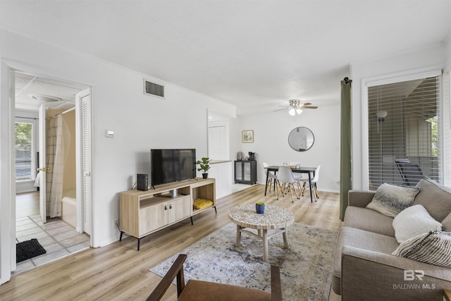 2086 N Seacliff Dr Unit 2086, Daphne, AL 36526 - living area with light wood-style flooring, a ceiling fan, and baseboards