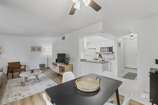 2086 N Seacliff Dr Unit 2086, Daphne, AL 36526 - living area with ceiling fan and light wood-style flooring