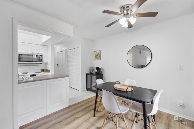 2086 N Seacliff Dr Unit 2086, Daphne, AL 36526 - dining space with a ceiling fan and light wood-style flooring