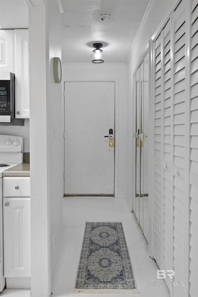 2086 N Seacliff Dr Unit 2086, Daphne, AL 36526 - doorway to outside with a textured ceiling