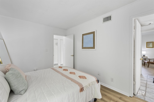 2086 N Seacliff Dr Unit 2086, Daphne, AL 36526 - bedroom featuring light wood-style flooring and baseboards