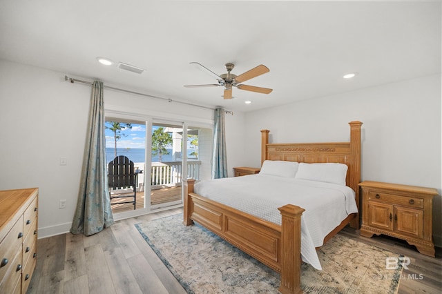 bedroom featuring light wood-style floors, access to outside, visible vents, and recessed lighting