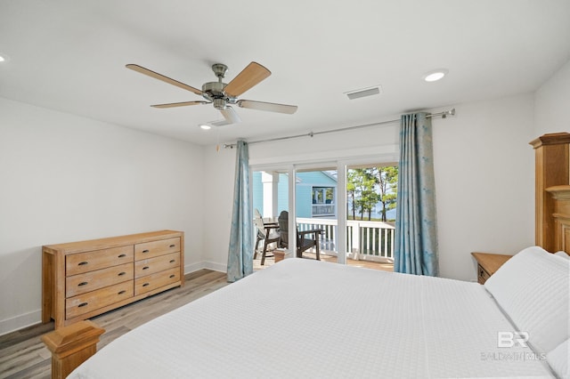 bedroom with light wood-style floors, access to outside, visible vents, and recessed lighting