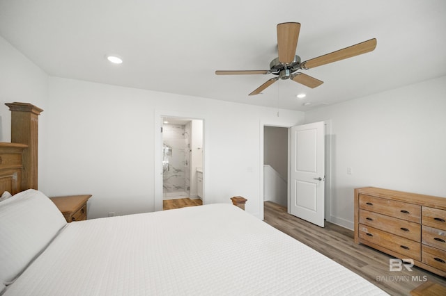 bedroom featuring a ceiling fan, recessed lighting, light wood-style flooring, and ensuite bathroom