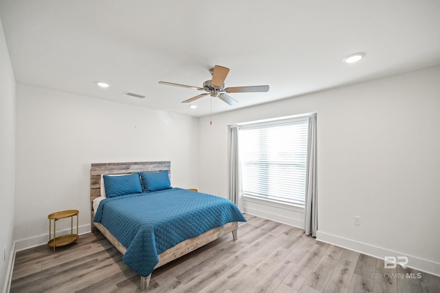 bedroom with visible vents, baseboards, light wood-style flooring, ceiling fan, and recessed lighting