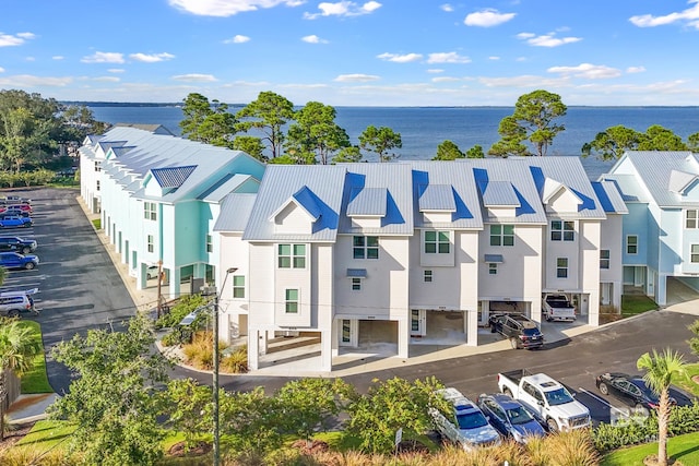 bird's eye view featuring a residential view and a water view