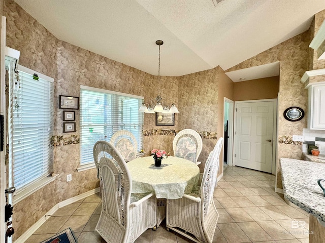 22835 County Road 12, Foley, AL 36535 - dining room featuring light tile patterned floors, a textured ceiling, vaulted ceiling, and baseboards