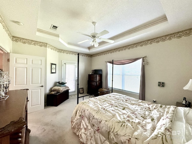 22835 County Road 12, Foley, AL 36535 - bedroom with a raised ceiling, light colored carpet, ornamental molding, a textured ceiling, and a ceiling fan