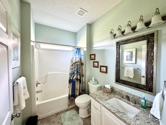 22835 County Road 12, Foley, AL 36535 - bathroom featuring vanity, toilet, shower / bath combination with curtain, and a textured ceiling