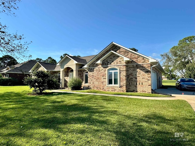 view of front facade with a front lawn and a garage