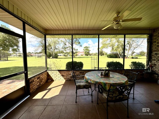 22835 County Road 12, Foley, AL 36535 - sunroom featuring a ceiling fan and outdoor dining area