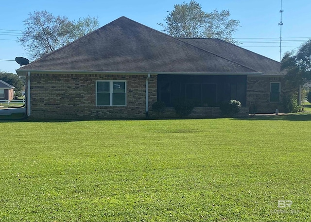 view of side of property featuring a yard