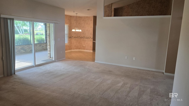 22835 County Road 12, Foley, AL 36535 - spare room with carpet, a chandelier, and baseboards