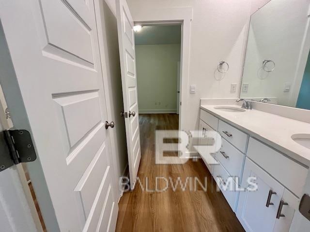 bathroom featuring vanity and wood-type flooring